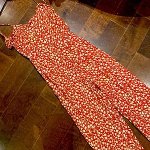 Super cute reformation floral romper with open back.